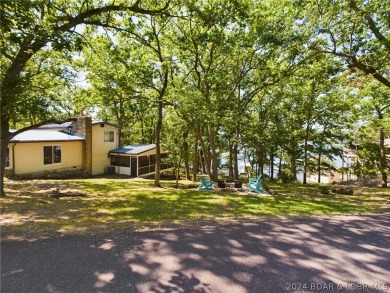 Welcome to 32280 Gliding Hawk, where modern luxury meets serene on Indian Rock Golf Club in Missouri - for sale on GolfHomes.com, golf home, golf lot