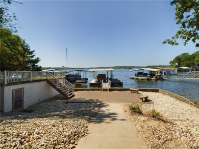 Welcome to 32280 Gliding Hawk, where modern luxury meets serene on Indian Rock Golf Club in Missouri - for sale on GolfHomes.com, golf home, golf lot