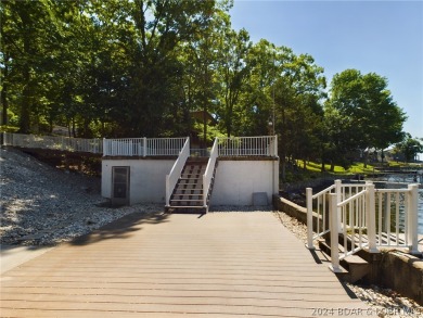 Welcome to 32280 Gliding Hawk, where modern luxury meets serene on Indian Rock Golf Club in Missouri - for sale on GolfHomes.com, golf home, golf lot