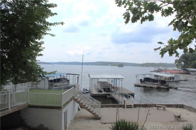 Welcome to 32280 Gliding Hawk, where modern luxury meets serene on Indian Rock Golf Club in Missouri - for sale on GolfHomes.com, golf home, golf lot