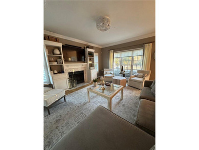 Beautiful brick-front traditional home located on the 7th hole on Williamsburg National Golf Club in Virginia - for sale on GolfHomes.com, golf home, golf lot