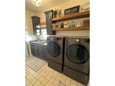 Beautiful brick-front traditional home located on the 7th hole on Williamsburg National Golf Club in Virginia - for sale on GolfHomes.com, golf home, golf lot