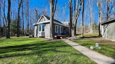 Welcome to your Northern Michigan retreat--just minutes from on Little Traverse Bay Golf Club and Restaurant in Michigan - for sale on GolfHomes.com, golf home, golf lot
