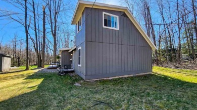 Welcome to your Northern Michigan retreat--just minutes from on Little Traverse Bay Golf Club and Restaurant in Michigan - for sale on GolfHomes.com, golf home, golf lot