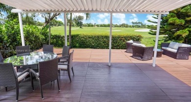 Stunning golf views. Mid-century modern home in the prestigious on Normandy Shores Golf Course in Florida - for sale on GolfHomes.com, golf home, golf lot