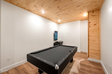 This newly constructed, fully furnished 4-bedroom, 4.5-bathroom on Sevierville Golf Club in Tennessee - for sale on GolfHomes.com, golf home, golf lot
