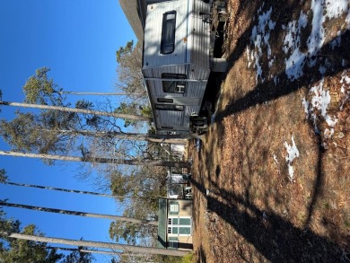 Lot with shed.  No perc on file.  Camper conveys as is and at no on Captains Cove Golf and Yacht Club in Virginia - for sale on GolfHomes.com, golf home, golf lot