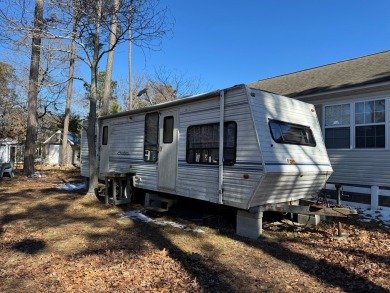 Lot with shed.  No perc on file.  Camper conveys as is and at no on Captains Cove Golf and Yacht Club in Virginia - for sale on GolfHomes.com, golf home, golf lot