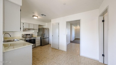 This Sun City home is freshly painted inside and out with on Sun City Lakes West and East in Arizona - for sale on GolfHomes.com, golf home, golf lot