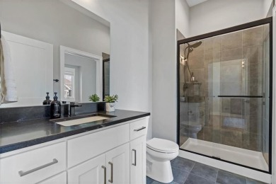 This 4-bedroom, 4-bath reverse 1.5-story is packed with upgrades on Heritage Park Golf Course in Kansas - for sale on GolfHomes.com, golf home, golf lot
