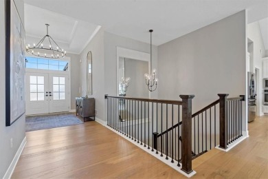 This 4-bedroom, 4-bath reverse 1.5-story is packed with upgrades on Heritage Park Golf Course in Kansas - for sale on GolfHomes.com, golf home, golf lot