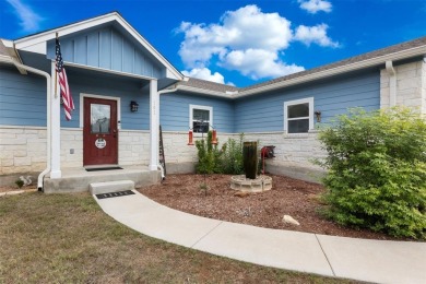 This beautifully designed stone home with blue and red accents on Lighthouse Golf Course in Texas - for sale on GolfHomes.com, golf home, golf lot