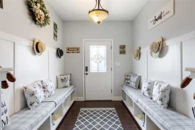 This beautifully designed stone home with blue and red accents on Lighthouse Golf Course in Texas - for sale on GolfHomes.com, golf home, golf lot