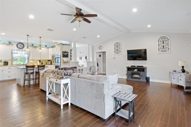 This beautifully designed stone home with blue and red accents on Lighthouse Golf Course in Texas - for sale on GolfHomes.com, golf home, golf lot
