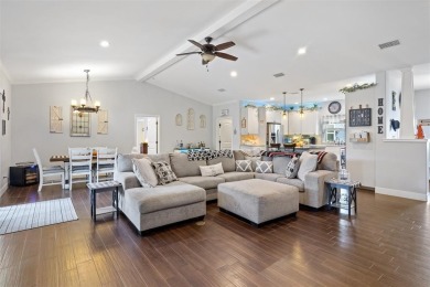 This beautifully designed stone home with blue and red accents on Lighthouse Golf Course in Texas - for sale on GolfHomes.com, golf home, golf lot