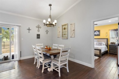 This beautifully designed stone home with blue and red accents on Lighthouse Golf Course in Texas - for sale on GolfHomes.com, golf home, golf lot