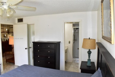 Nice first floor condo with a water view is perfect for those on Sunrise Lakes Phase III in Florida - for sale on GolfHomes.com, golf home, golf lot