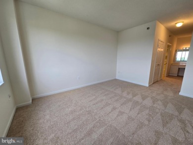 Sky-high living in this top floor condo with 2 spacious bedrooms on Leisure World Golf Club in Maryland - for sale on GolfHomes.com, golf home, golf lot