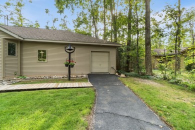 Enjoy sweeping golf course views and your own personal cart path on Gaylord Country Club in Michigan - for sale on GolfHomes.com, golf home, golf lot