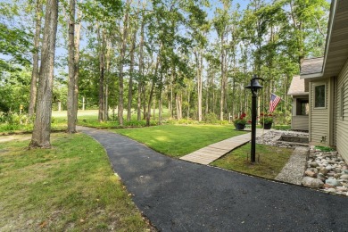Enjoy sweeping golf course views and your own personal cart path on Gaylord Country Club in Michigan - for sale on GolfHomes.com, golf home, golf lot