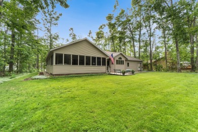 Enjoy sweeping golf course views and your own personal cart path on Gaylord Country Club in Michigan - for sale on GolfHomes.com, golf home, golf lot