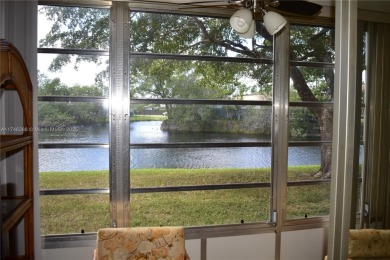 Nice first floor condo with a water view is perfect for those on Sunrise Lakes Phase III in Florida - for sale on GolfHomes.com, golf home, golf lot