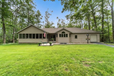 Enjoy sweeping golf course views and your own personal cart path on Gaylord Country Club in Michigan - for sale on GolfHomes.com, golf home, golf lot