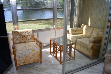 Nice first floor condo with a water view is perfect for those on Sunrise Lakes Phase III in Florida - for sale on GolfHomes.com, golf home, golf lot