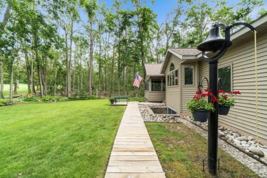 Enjoy sweeping golf course views and your own personal cart path on Gaylord Country Club in Michigan - for sale on GolfHomes.com, golf home, golf lot