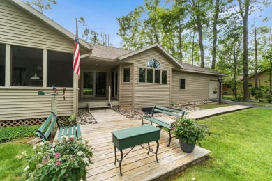 Enjoy sweeping golf course views and your own personal cart path on Gaylord Country Club in Michigan - for sale on GolfHomes.com, golf home, golf lot