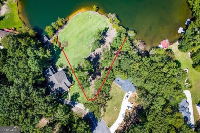 Discover lakeside living at its finest with this stunning on Fairfield Plantation Golf and Country Club in Georgia - for sale on GolfHomes.com, golf home, golf lot