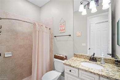 Set against tranquil lake views in highly sought-after Bonita on Bonita National Golf Course in Florida - for sale on GolfHomes.com, golf home, golf lot