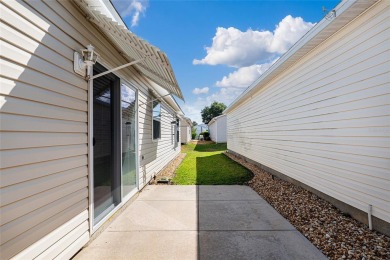 WELCOME to this PRISTINE PATIO VILLA in The Villages. This 2 on The Links of Spruce Creek in Florida - for sale on GolfHomes.com, golf home, golf lot