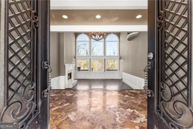 This stunning home is located in the prestigious gated section on The Golf Club of Georgia in Georgia - for sale on GolfHomes.com, golf home, golf lot