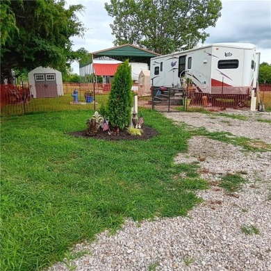 This peaceful slice of lake life is ready for you! With this on Linn Valley Lakes - Deer Trace Golf Course in Kansas - for sale on GolfHomes.com, golf home, golf lot