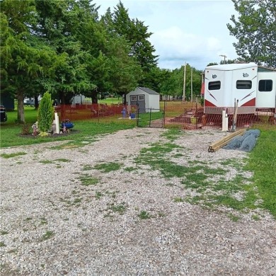 This peaceful slice of lake life is ready for you! With this on Linn Valley Lakes - Deer Trace Golf Course in Kansas - for sale on GolfHomes.com, golf home, golf lot