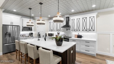 Welcome to 140 Utsesti Way! Discover contemporary elegance and on Toqua Golf Course - Loudon County in Tennessee - for sale on GolfHomes.com, golf home, golf lot