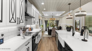 Welcome to 140 Utsesti Way! Discover contemporary elegance and on Toqua Golf Course - Loudon County in Tennessee - for sale on GolfHomes.com, golf home, golf lot