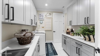 Welcome to 140 Utsesti Way! Discover contemporary elegance and on Toqua Golf Course - Loudon County in Tennessee - for sale on GolfHomes.com, golf home, golf lot