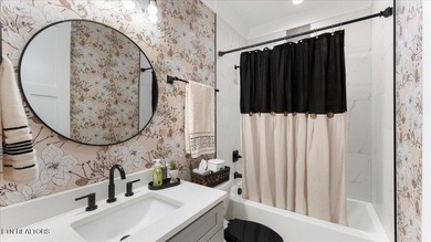 Welcome to 140 Utsesti Way! Discover contemporary elegance and on Toqua Golf Course - Loudon County in Tennessee - for sale on GolfHomes.com, golf home, golf lot