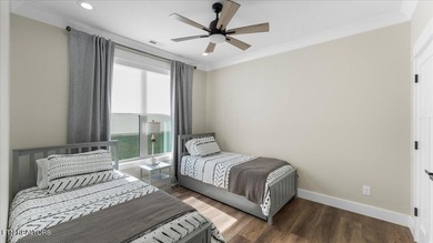 Welcome to 140 Utsesti Way! Discover contemporary elegance and on Toqua Golf Course - Loudon County in Tennessee - for sale on GolfHomes.com, golf home, golf lot