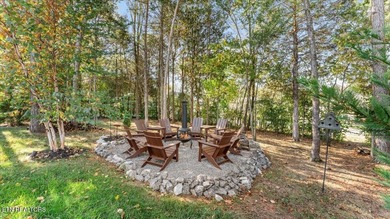 Welcome to 140 Utsesti Way! Discover contemporary elegance and on Toqua Golf Course - Loudon County in Tennessee - for sale on GolfHomes.com, golf home, golf lot