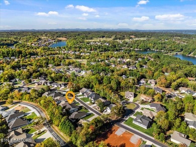 Welcome to 140 Utsesti Way! Discover contemporary elegance and on Toqua Golf Course - Loudon County in Tennessee - for sale on GolfHomes.com, golf home, golf lot