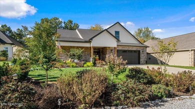 Welcome to 140 Utsesti Way! Discover contemporary elegance and on Toqua Golf Course - Loudon County in Tennessee - for sale on GolfHomes.com, golf home, golf lot