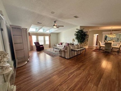 This beautiful triple-wide home, located on the golf course on Four Lakes Golf Club in Florida - for sale on GolfHomes.com, golf home, golf lot