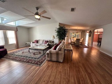 This beautiful triple-wide home, located on the golf course on Four Lakes Golf Club in Florida - for sale on GolfHomes.com, golf home, golf lot