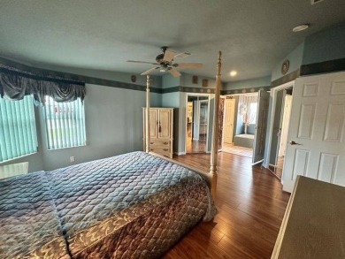 This beautiful triple-wide home, located on the golf course on Four Lakes Golf Club in Florida - for sale on GolfHomes.com, golf home, golf lot