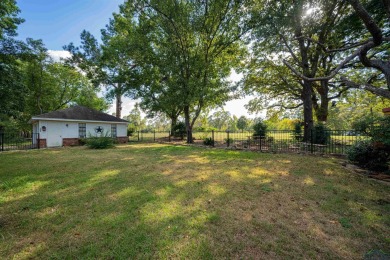 Tucked away in the serene, gated community of Holly Lake Ranch on Holly Lake Ranch Golf Club in Texas - for sale on GolfHomes.com, golf home, golf lot