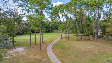 Tucked away in the serene, gated community of Holly Lake Ranch on Holly Lake Ranch Golf Club in Texas - for sale on GolfHomes.com, golf home, golf lot