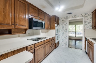 New flooring in living room, kitchen 2 bedrooms and 2 bathrooms on Texas Rangers Golf Club  in Texas - for sale on GolfHomes.com, golf home, golf lot